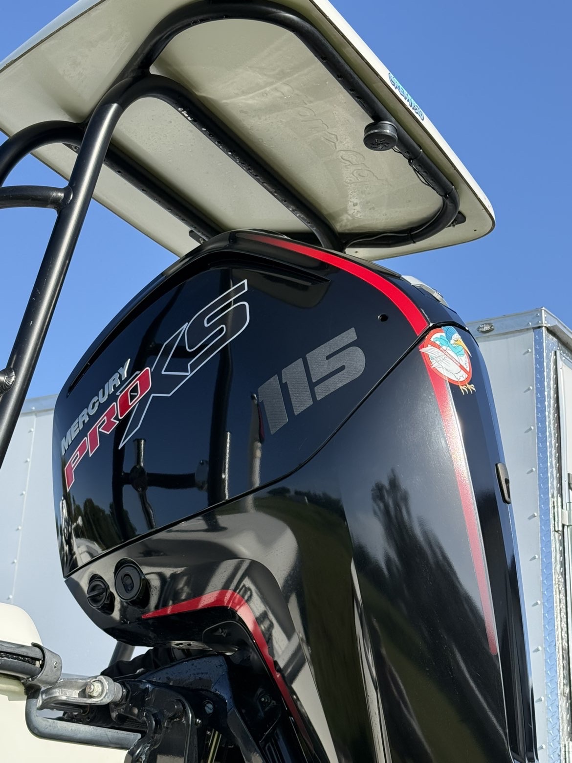 Close view of boat branding and outboard